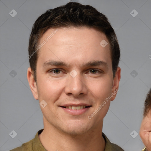 Joyful white adult male with short  brown hair and brown eyes