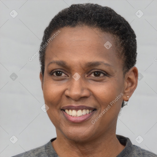 Joyful latino adult female with short  brown hair and brown eyes