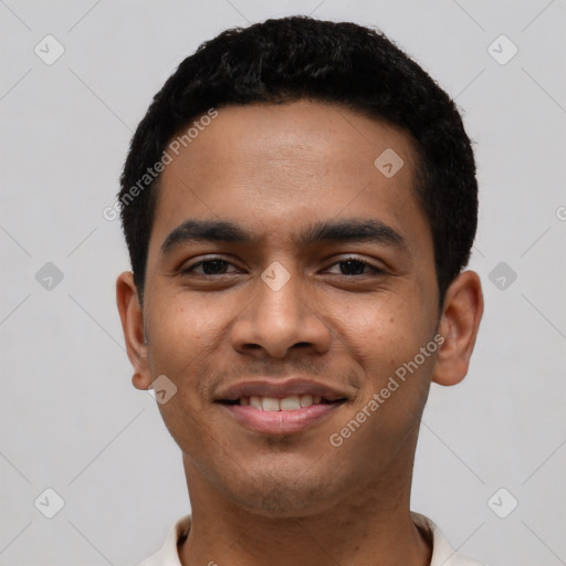 Joyful latino young-adult male with short  black hair and brown eyes