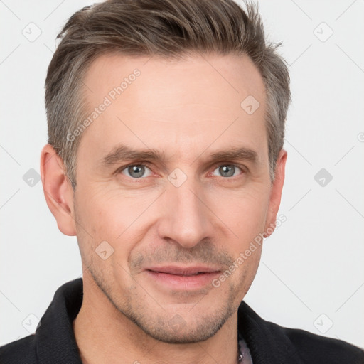 Joyful white adult male with short  brown hair and grey eyes