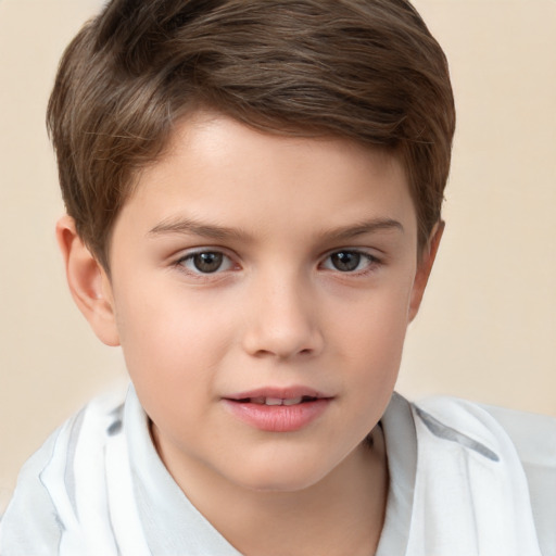 Joyful white child male with short  brown hair and brown eyes