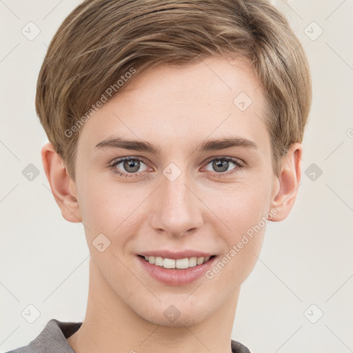 Joyful white young-adult female with short  brown hair and grey eyes