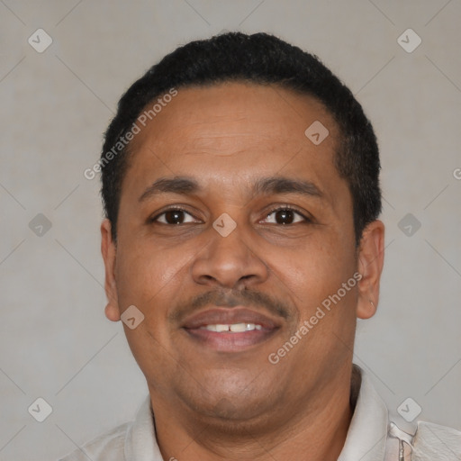 Joyful latino adult male with short  black hair and brown eyes