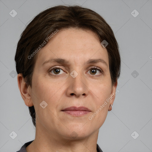 Joyful white adult female with short  brown hair and grey eyes