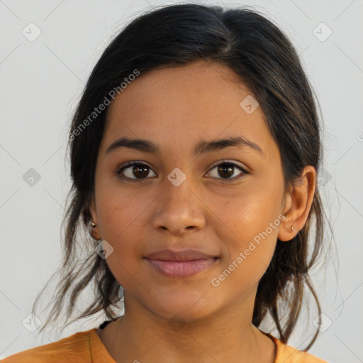 Joyful latino young-adult female with medium  brown hair and brown eyes