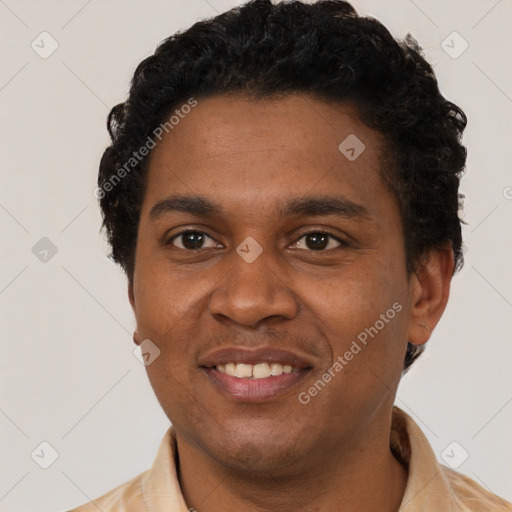 Joyful black young-adult male with short  brown hair and brown eyes