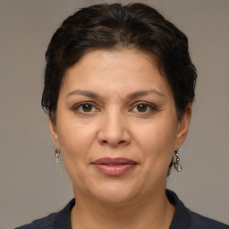 Joyful white adult female with short  brown hair and brown eyes