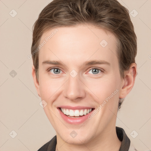 Joyful white young-adult female with short  brown hair and grey eyes