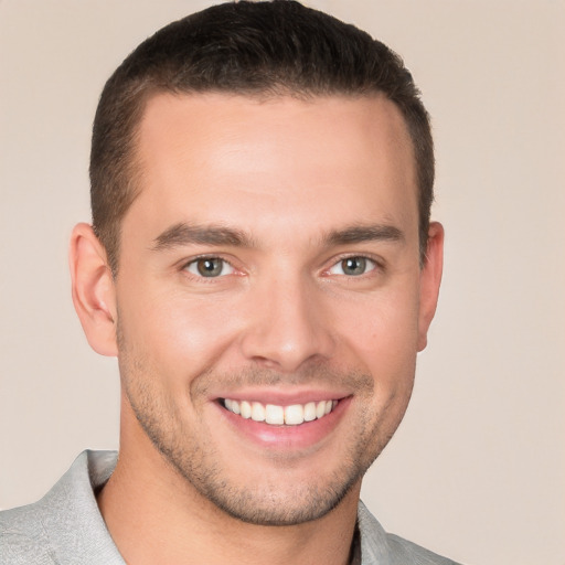 Joyful white young-adult male with short  brown hair and brown eyes