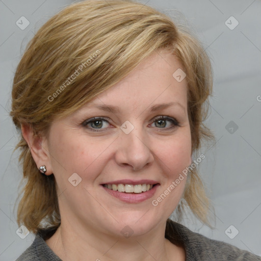 Joyful white adult female with medium  brown hair and blue eyes