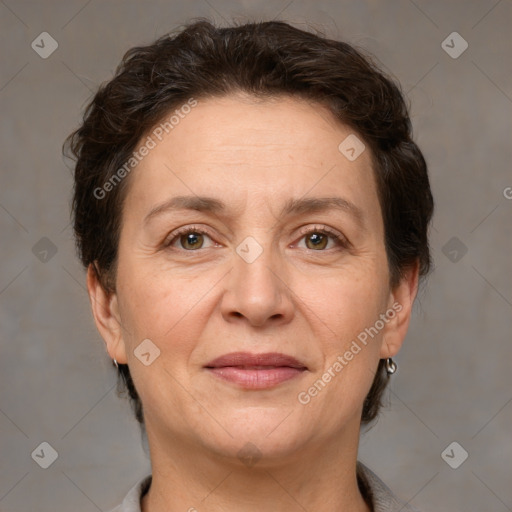 Joyful white adult female with short  brown hair and grey eyes