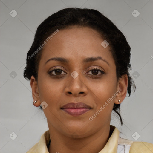 Joyful black young-adult female with short  brown hair and brown eyes