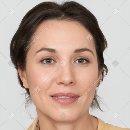 Joyful white adult female with medium  brown hair and brown eyes