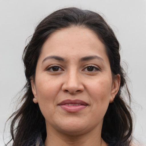 Joyful white adult female with medium  brown hair and brown eyes