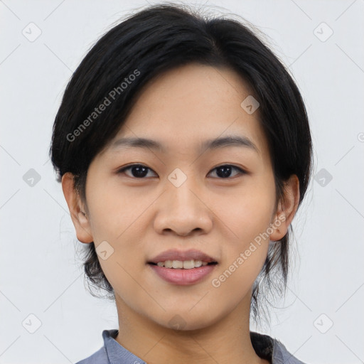 Joyful asian young-adult female with medium  black hair and brown eyes