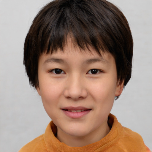 Joyful asian child female with short  brown hair and brown eyes