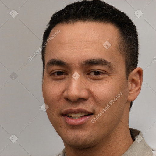 Joyful white young-adult male with short  black hair and brown eyes