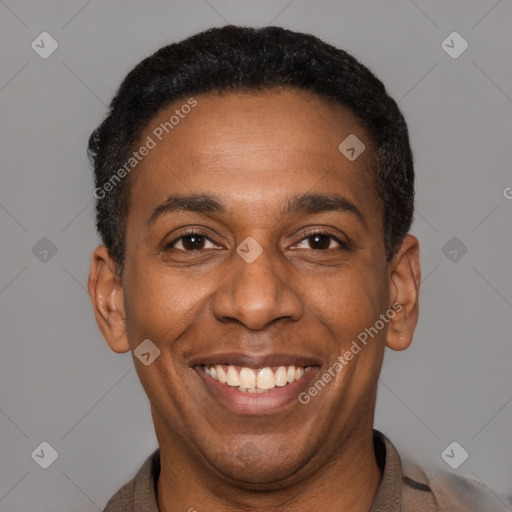 Joyful latino adult male with short  black hair and brown eyes