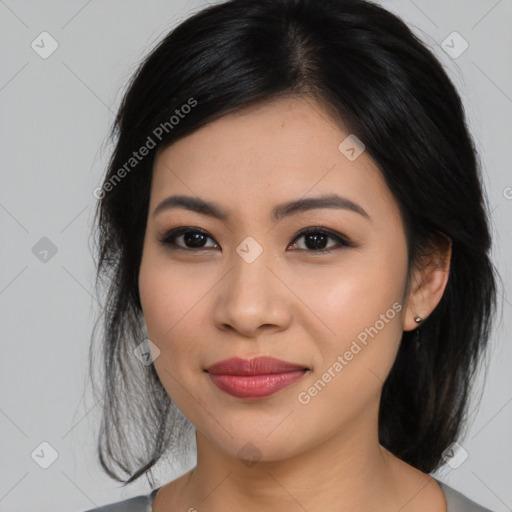 Joyful latino young-adult female with medium  black hair and brown eyes