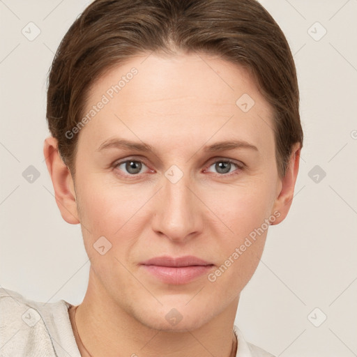 Joyful white young-adult female with short  brown hair and grey eyes