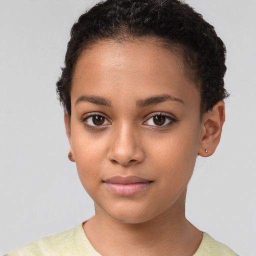 Joyful latino child female with short  brown hair and brown eyes
