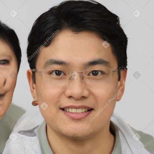 Joyful asian young-adult male with short  brown hair and brown eyes