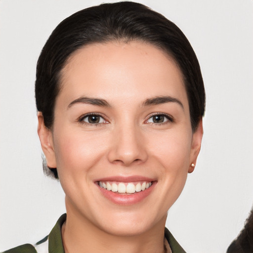 Joyful white young-adult female with short  brown hair and brown eyes