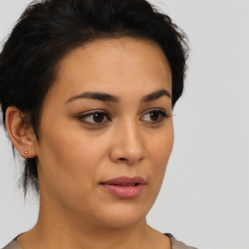 Neutral latino young-adult female with short  brown hair and brown eyes