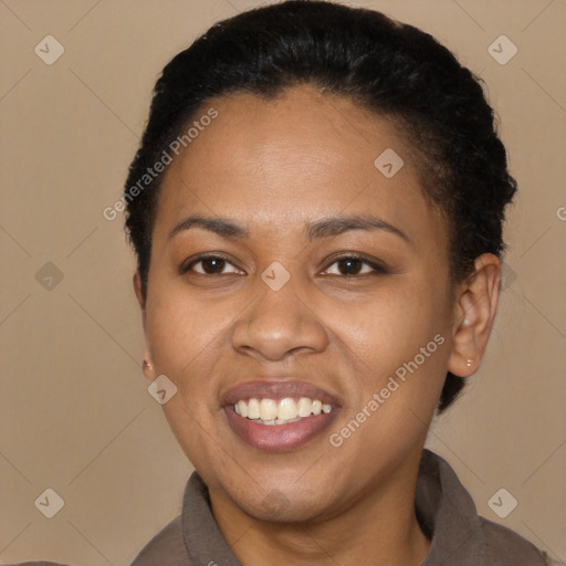 Joyful black adult female with short  black hair and brown eyes