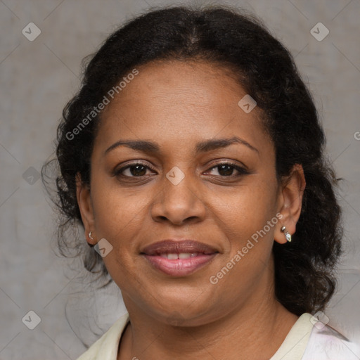 Joyful black adult female with medium  brown hair and brown eyes