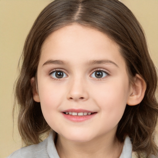 Joyful white child female with medium  brown hair and brown eyes