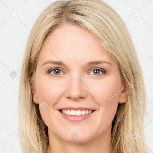 Joyful white young-adult female with long  brown hair and blue eyes