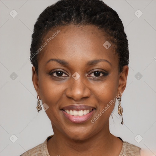 Joyful black young-adult female with short  brown hair and brown eyes