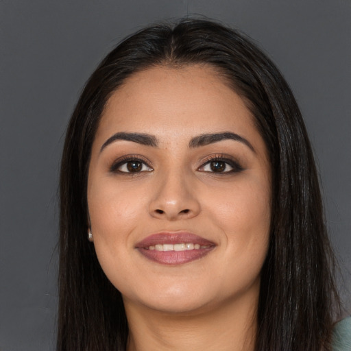 Joyful asian young-adult female with long  brown hair and brown eyes