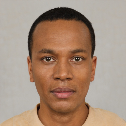Neutral black young-adult male with short  black hair and brown eyes