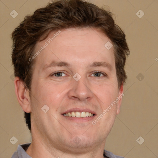 Joyful white adult male with short  brown hair and grey eyes