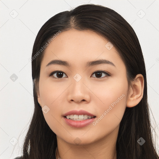 Joyful asian young-adult female with long  black hair and brown eyes