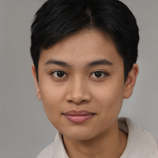 Joyful asian young-adult female with short  black hair and brown eyes