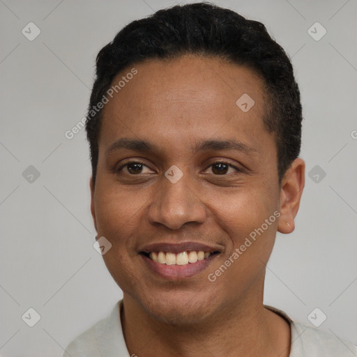 Joyful latino young-adult male with short  black hair and brown eyes