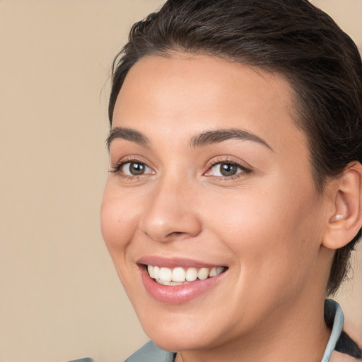 Joyful white young-adult female with long  brown hair and brown eyes