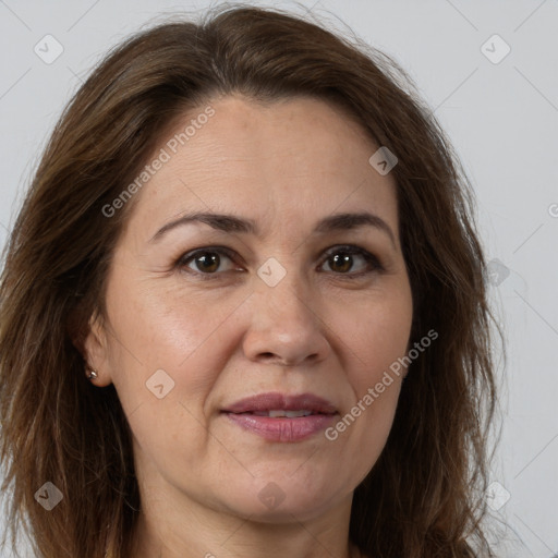 Joyful white adult female with long  brown hair and brown eyes