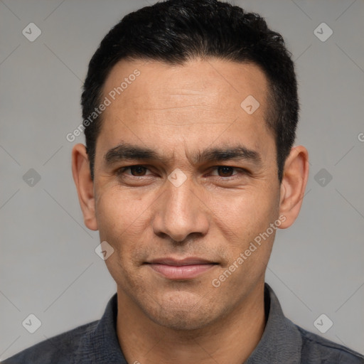 Joyful white adult male with short  black hair and brown eyes