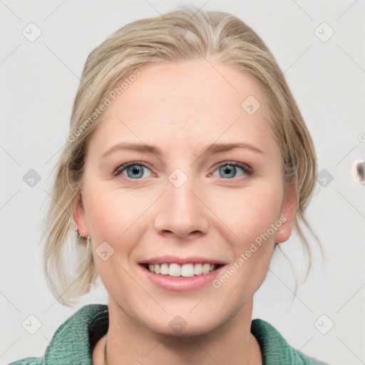 Joyful white young-adult female with medium  brown hair and blue eyes