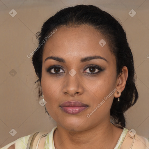 Joyful black young-adult female with medium  brown hair and brown eyes
