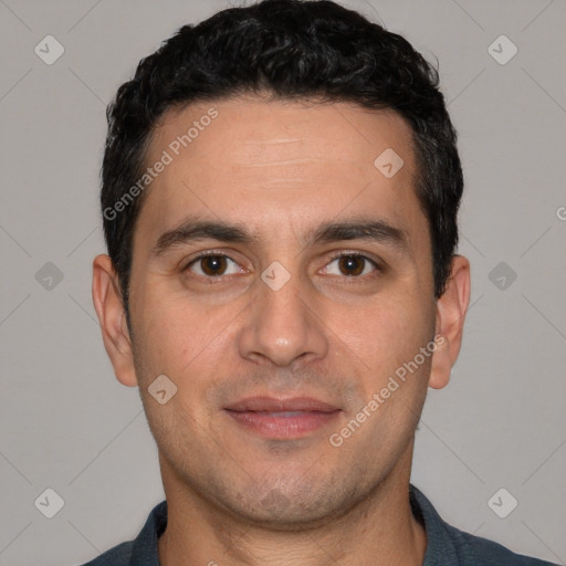 Joyful white young-adult male with short  black hair and brown eyes