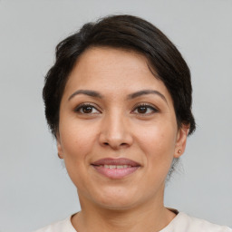 Joyful white adult female with short  brown hair and brown eyes