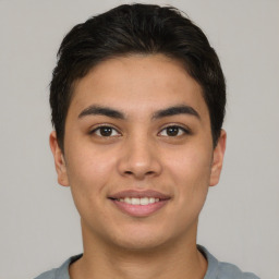 Joyful asian young-adult male with short  brown hair and brown eyes