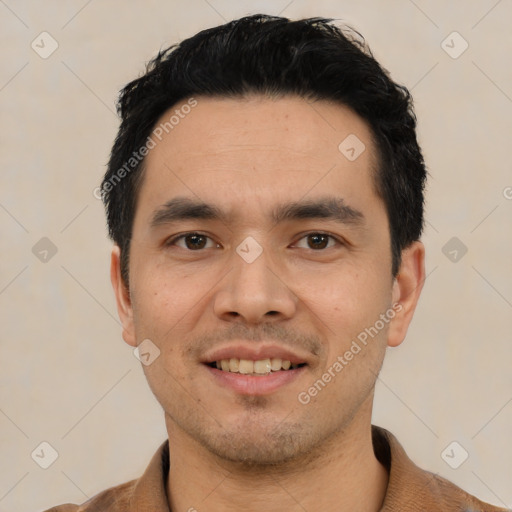 Joyful asian young-adult male with short  black hair and brown eyes