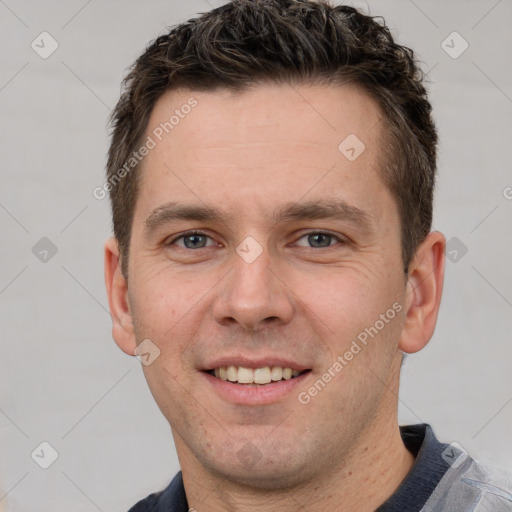 Joyful white young-adult male with short  brown hair and grey eyes