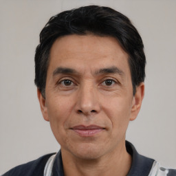 Joyful white adult male with short  black hair and brown eyes